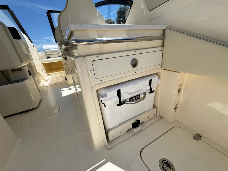 Slide: The Image of 2025 Scout 277 Dorado interior with Yeti cooler storage compartment. - 13