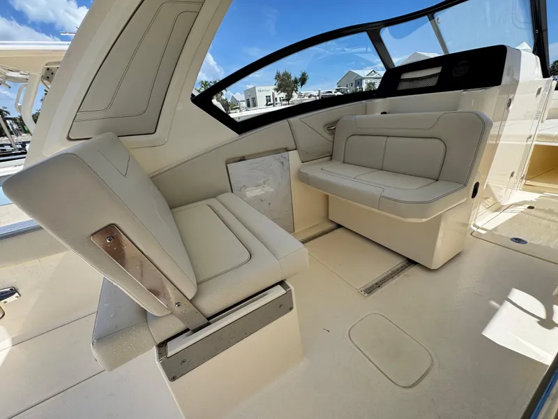 Slide: The Image of 2025 Scout 277 Dorado boat interior with beige seating and modern design. - 18