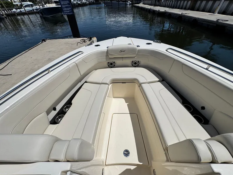Slide: The Image of 2025 Scout 277 Dorado boat interior with spacious seating at marina. - 22