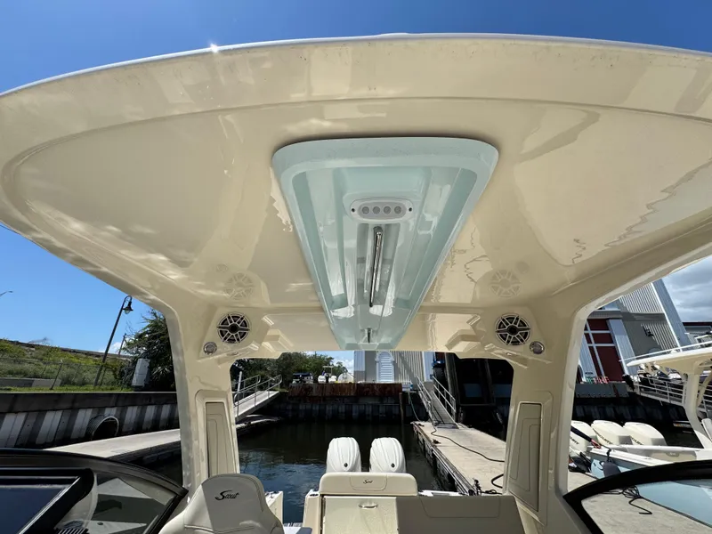 Slide: The Image of 2025 Scout 277 Dorado boat interior with speakers and overhead lighting. - 25