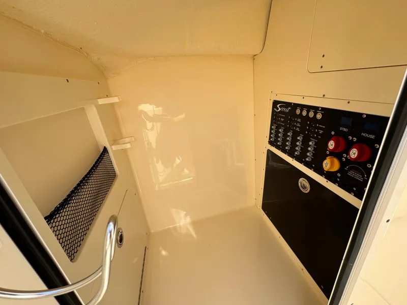 Slide: The Image of 2025 Scout 277 Dorado interior with control panel and storage net. - 29