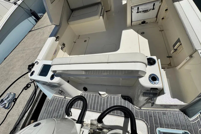 Slide: The Image of 2025 Scout 277 Dorado boat interior with seating and storage compartments. - 8