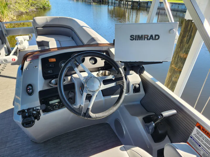 Slide: The Image of 2021 Bennington SX 21 L-Bench boat helm with Simrad navigation system. - 14