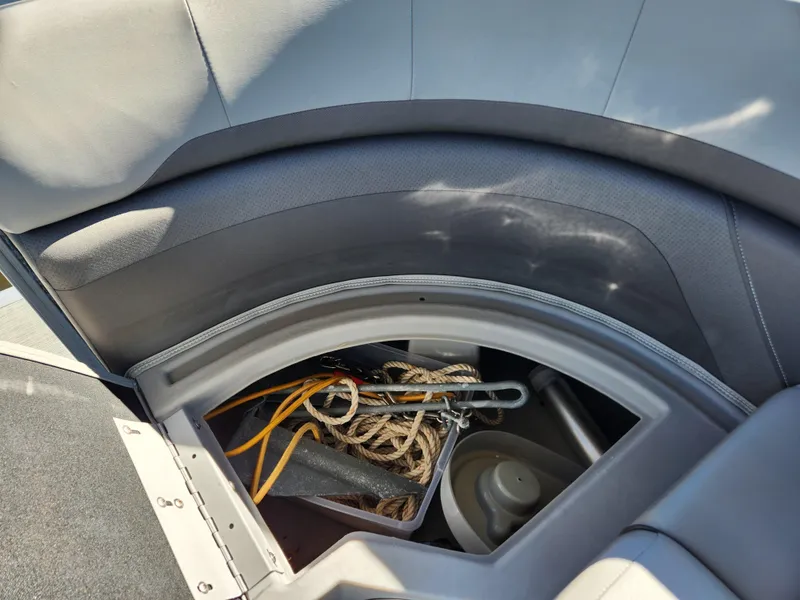 Slide: The Image of Storage compartment in 2021 Bennington SX 21 L-Bench boat with ropes and anchor. - 20