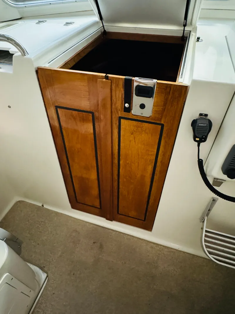 Slide: The Image of 2006 Back Cove Hardtop Express wooden cabinet interior detail. - 13