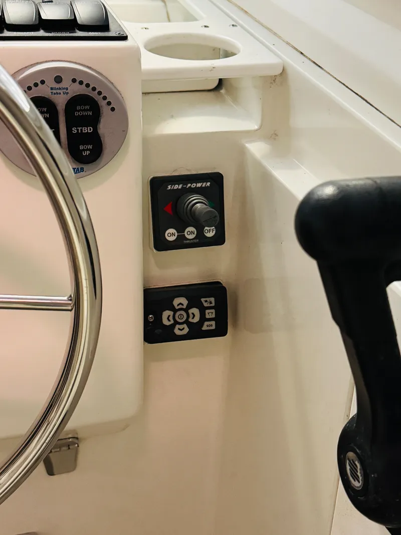 Slide: The Image of 2006 Back Cove Hardtop Express boat controls and steering wheel close-up. - 6
