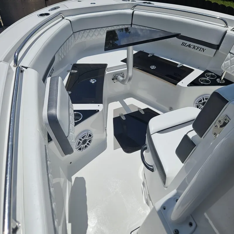 Slide: The Image of 2019 Blackfin 222 CC boat interior with seating and storage compartments. - 16