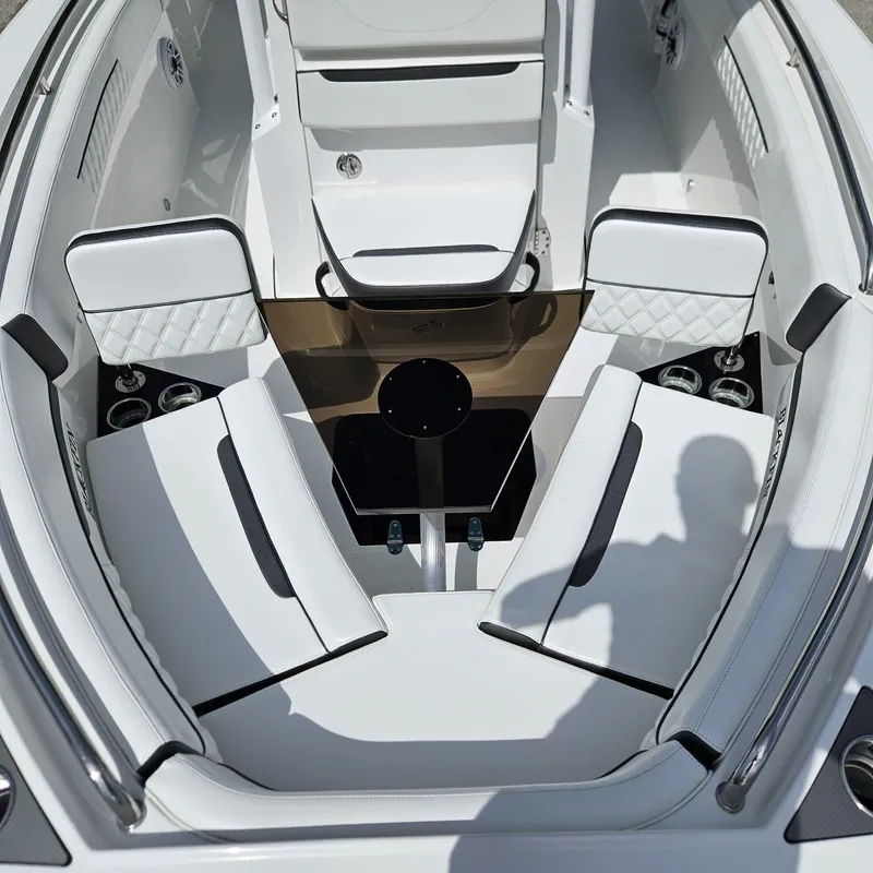 Slide: The Image of 2019 Blackfin 222 CC boat interior with white seating and cup holders. - 4