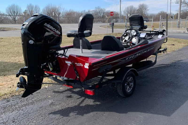 Slide: The Image of 2021 Tracker 175 TXW Tournament Edition boat with Mercury engine on a trailer. - 4