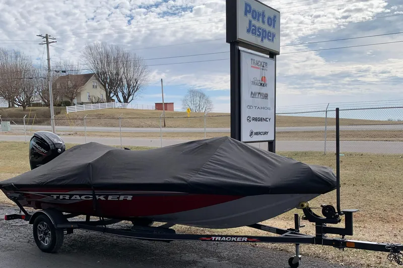 Slide: The Image of 2021 Tracker 175 TXW Tournament Edition boat covered on trailer at Port of Jasper. - 7