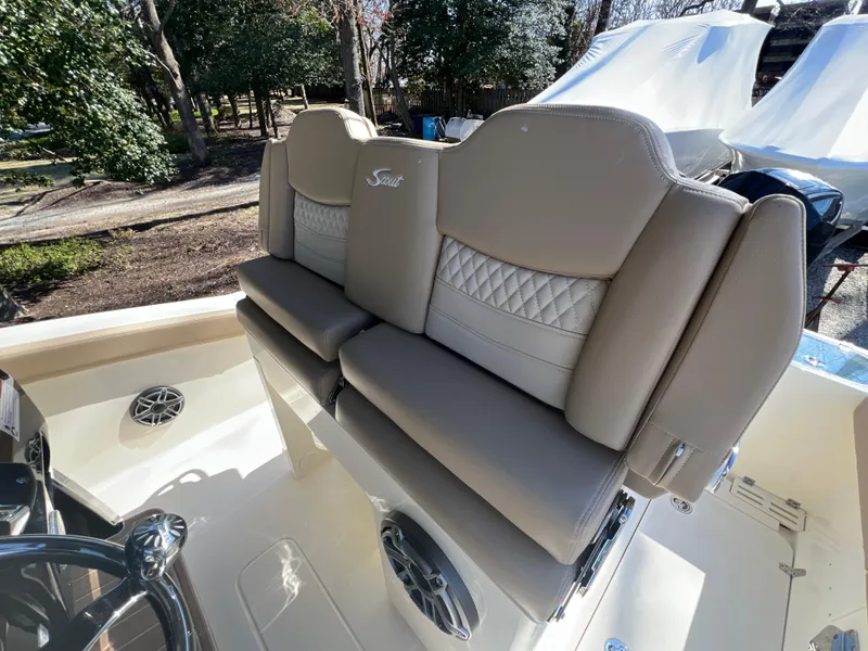 Slide: The Image of 2025 Scout 260 LXF boat interior with beige seating and stylish design. - 16