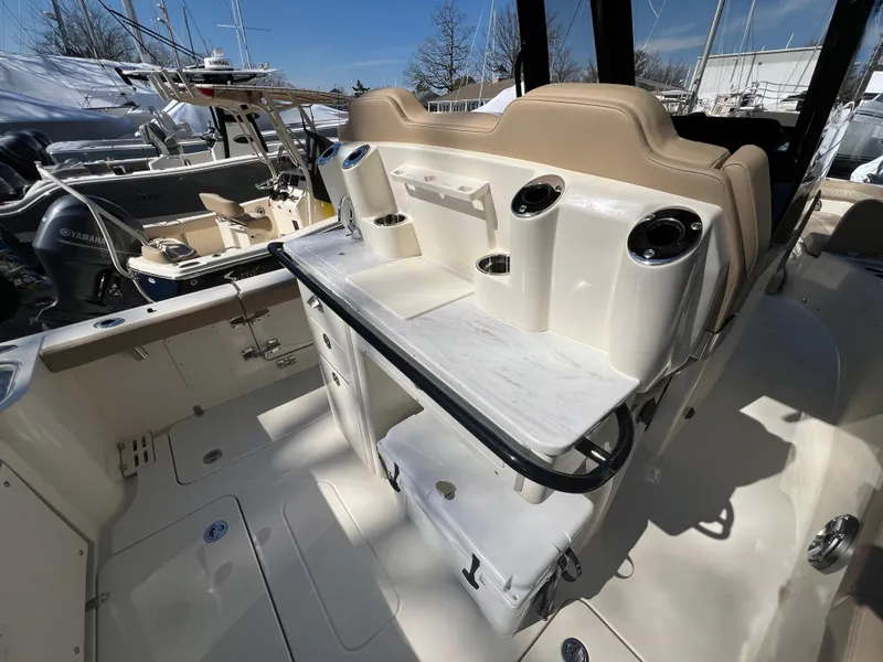 Slide: The Image of 2025 Scout 260 LXF boat interior with seating and storage compartments. - 17