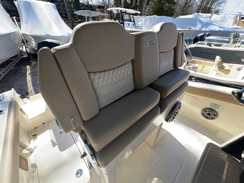 Slide: The Image of 2025 Scout 260 LXF boat seats with beige upholstery and stylish design. - 19