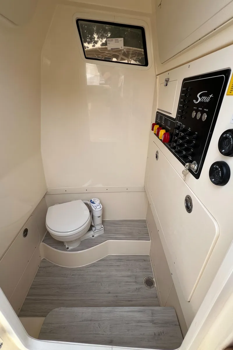 Slide: The Image of 2025 Scout 260 LXF boat interior with toilet and control panel. - 9