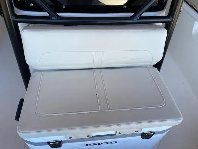 Slide: The Image of Boston Whaler 210 Montauk 2025 boat seat with Igloo cooler underneath. - 6