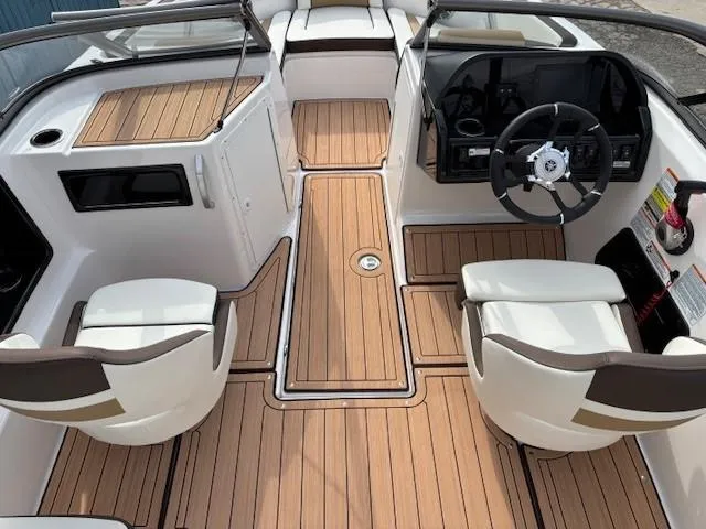 Slide: The Image of 2021 Yamaha Boats 195S interior with sleek design and modern dashboard. - 10