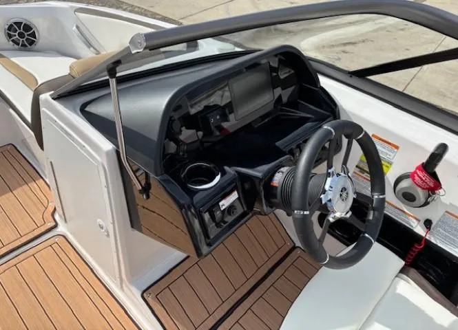 Slide: The Image of 2021 Yamaha Boats 195S dashboard with steering wheel and modern controls. - 16