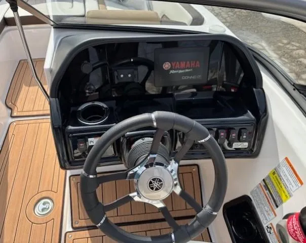 Slide: The Image of 2021 Yamaha Boats 195S dashboard with steering wheel and control panel. - 17