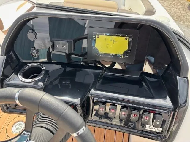 Slide: The Image of Dashboard of 2021 Yamaha Boats 195S with navigation screen and controls. - 18