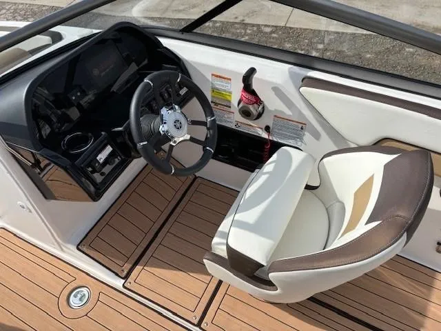 Slide: The Image of 2021 Yamaha Boats 195S cockpit with steering wheel and comfortable seating. - 20