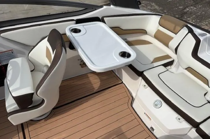 Slide: The Image of 2021 Yamaha Boats 195S interior with seating and table, featuring elegant design and comfort. - 21