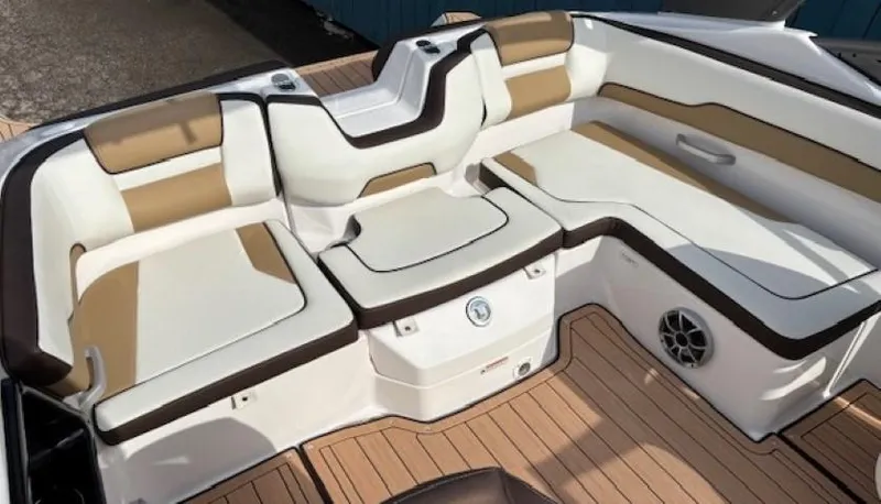 Slide: The Image of 2021 Yamaha Boats 195S interior with tan and white seating, featuring a sleek design. - 22