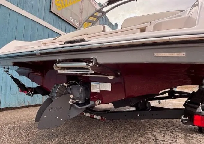Slide: The Image of 2021 Yamaha Boats 195S rear view, showcasing propeller and hull design. - 4
