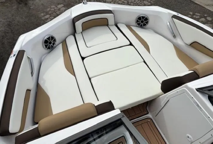 Slide: The Image of 2021 Yamaha Boats 195S interior with cushioned seating and built-in speakers. - 9
