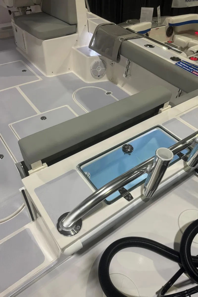 Slide: The Image of 2025 NorthCoast 255 HT boat interior with seating and storage features. - 2