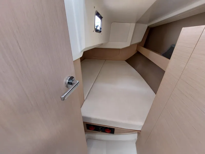 Slide: The Image of Beneteau Oceanis 30.1 cabin interior, 2020 model, featuring a cozy sleeping area. - 24