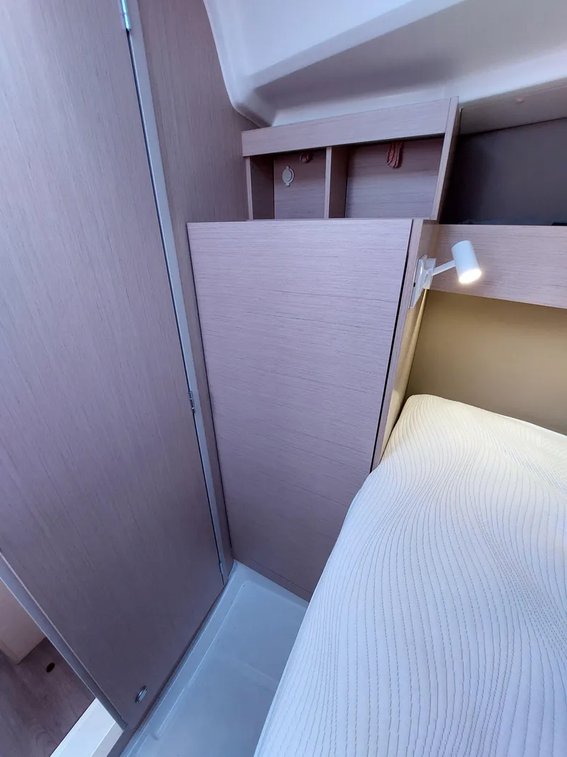 Slide: The Image of Interior cabin of 2020 Beneteau Oceanis 30.1 yacht with modern wood finish. - 36