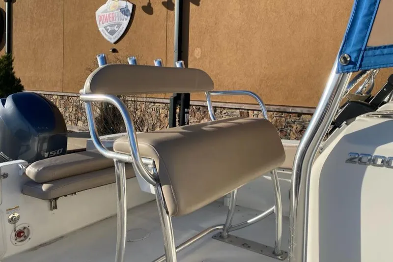 Slide: The Image of 2015 NauticStar 2000XS boat interior with seating and Yamaha engine. - 4