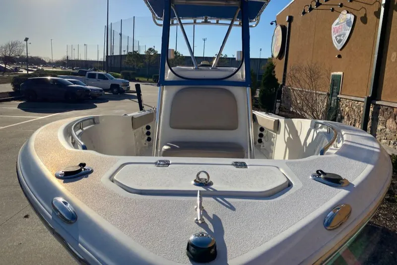 Slide: The Image of 2015 NauticStar 2000XS boat, front view, parked outdoors in a sunny setting. - 5