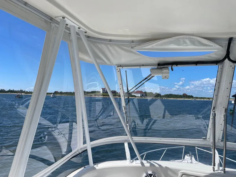 Slide: The Image of 2005 Riviera 40 Flybridge interior view with ocean backdrop and clear skies. - 27