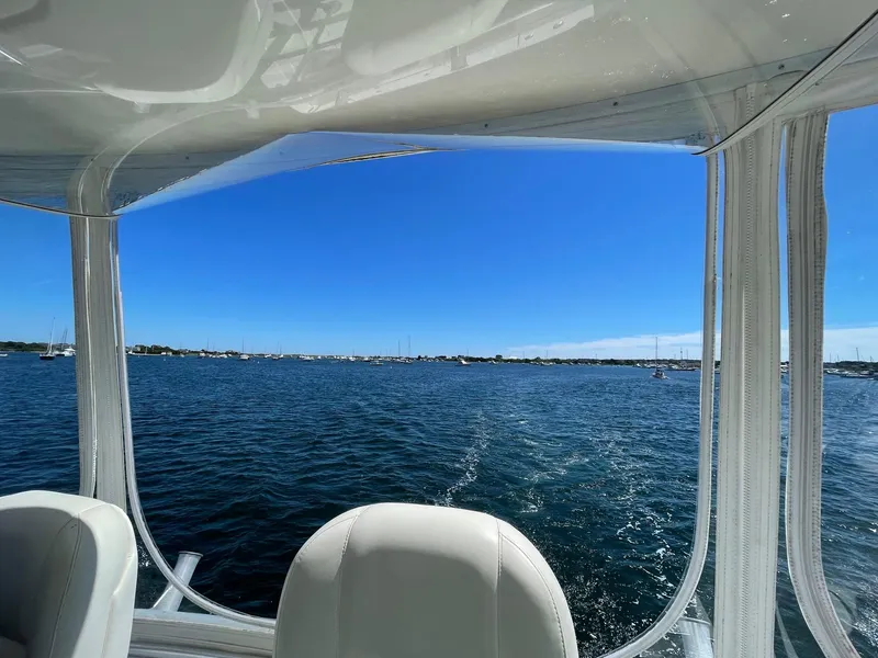 Slide: The Image of View from a 2005 Riviera 40 Flybridge boat, overlooking a serene blue sea. - 28