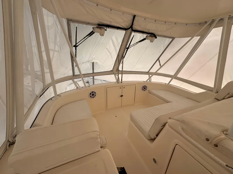 Slide: The Image of Interior view of 2005 Riviera 40 Flybridge yacht with cushioned seating. - 31