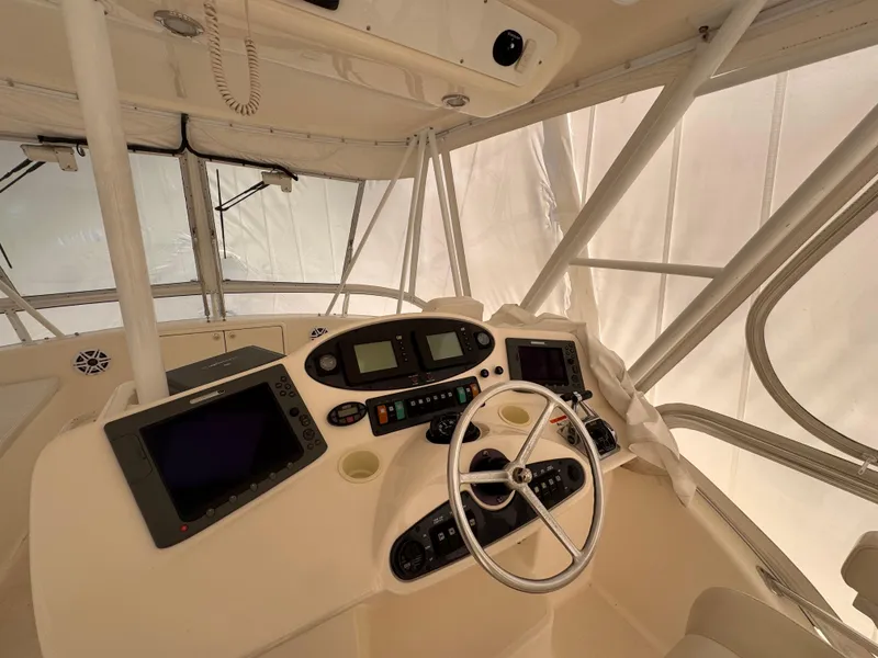 Slide: The Image of 2005 Riviera 40 Flybridge helm with navigation equipment and steering wheel. - 33