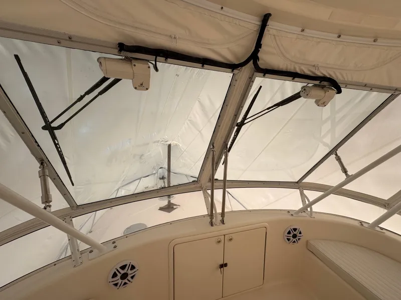 Slide: The Image of 2005 Riviera 40 Flybridge interior with clear windows and seating area. - 36