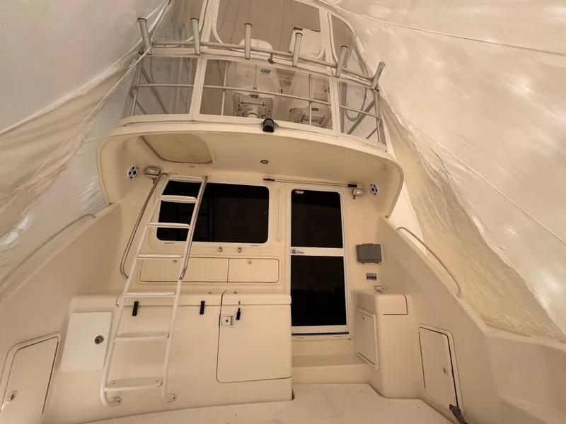 Slide: The Image of 2005 Riviera 40 Flybridge interior with ladder and upper deck view. - 37
