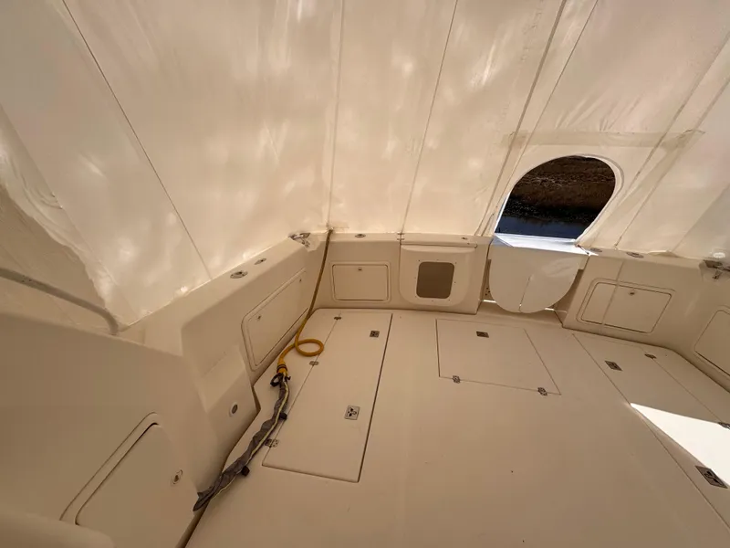 Slide: The Image of Interior view of 2005 Riviera 40 Flybridge boat with white canopy. - 39