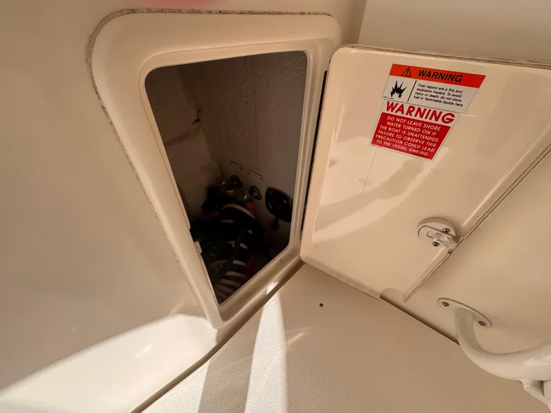 Slide: The Image of Access panel on 2005 Riviera 40 Flybridge with warning label visible. - 46