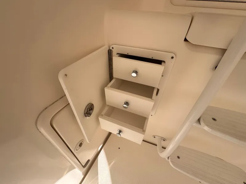 Slide: The Image of Storage drawers on a 2005 Riviera 40 Flybridge yacht, under stair compartment. - 47