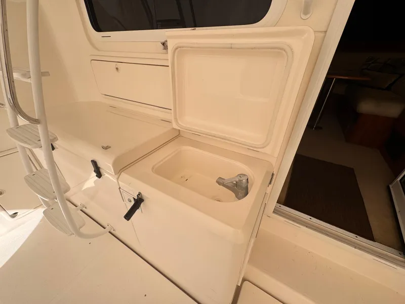 Slide: The Image of 2005 Riviera 40 Flybridge yacht interior with open storage compartment. - 50