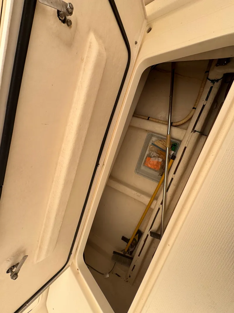 Slide: The Image of Storage compartment inside a 2005 Riviera 40 Flybridge boat. - 52