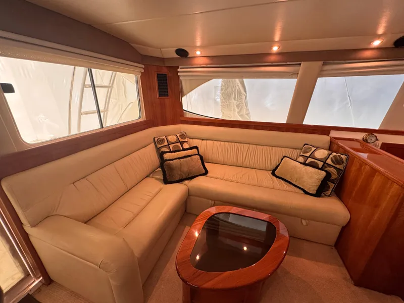 Slide: The Image of Luxurious interior of 2005 Riviera 40 Flybridge yacht with plush seating and elegant decor. - 7