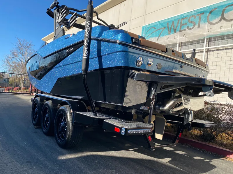 Slide: The Image of 2025 Malibu M230 boat on trailer at West Coast Boat Center. - 3