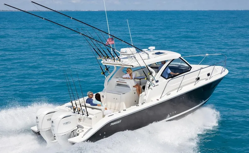 Slide: The Image of 2025 Pursuit OS 325 boat cruising on open water, equipped with fishing rods. - 0