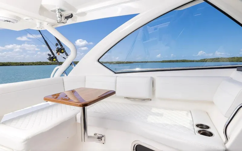Slide: The Image of Luxurious interior of 2025 Pursuit OS 325 yacht with scenic ocean view. - 11
