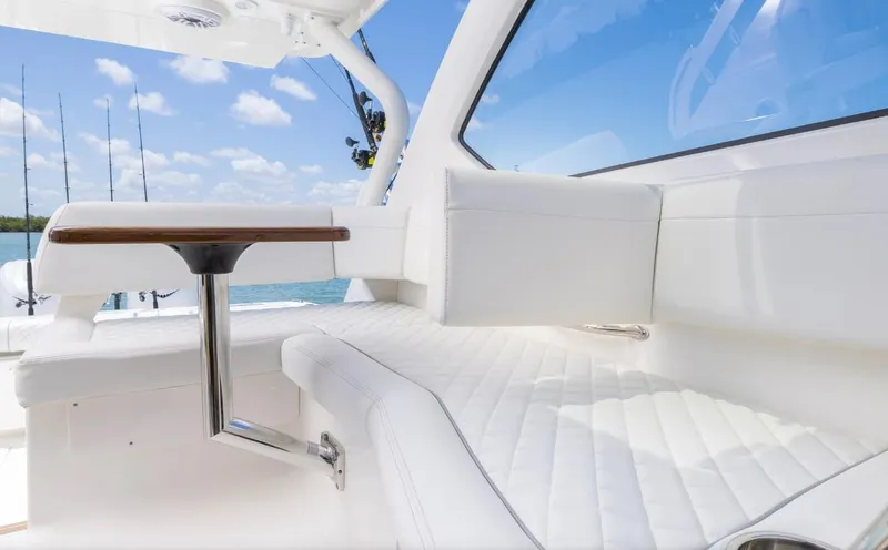 Slide: The Image of Luxurious interior of 2025 Pursuit OS 325 boat with white seating and table. - 12
