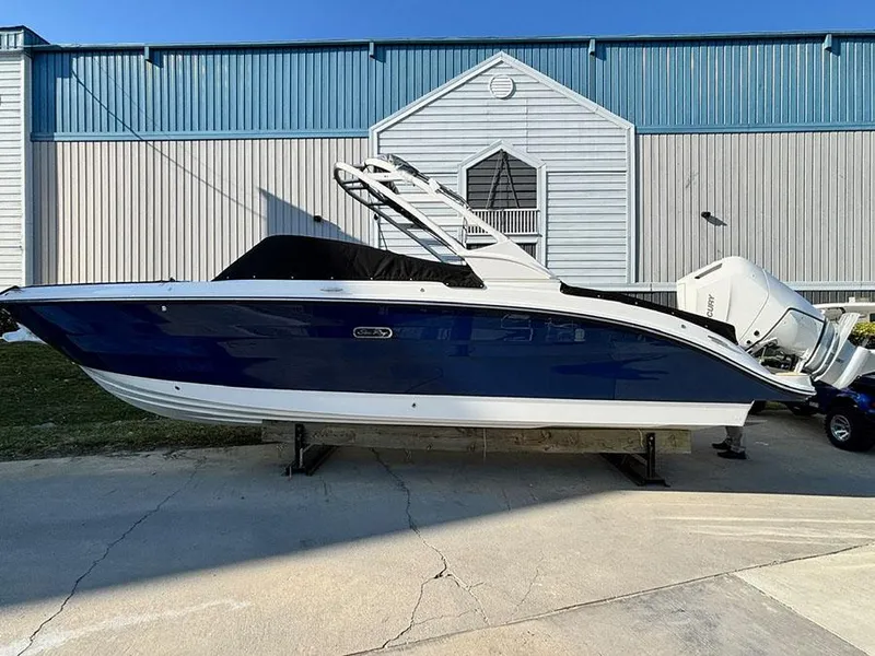 The Image of 2025 Sea Ray SDX 270 Outboard boat, blue hull, displayed outdoors. - 0